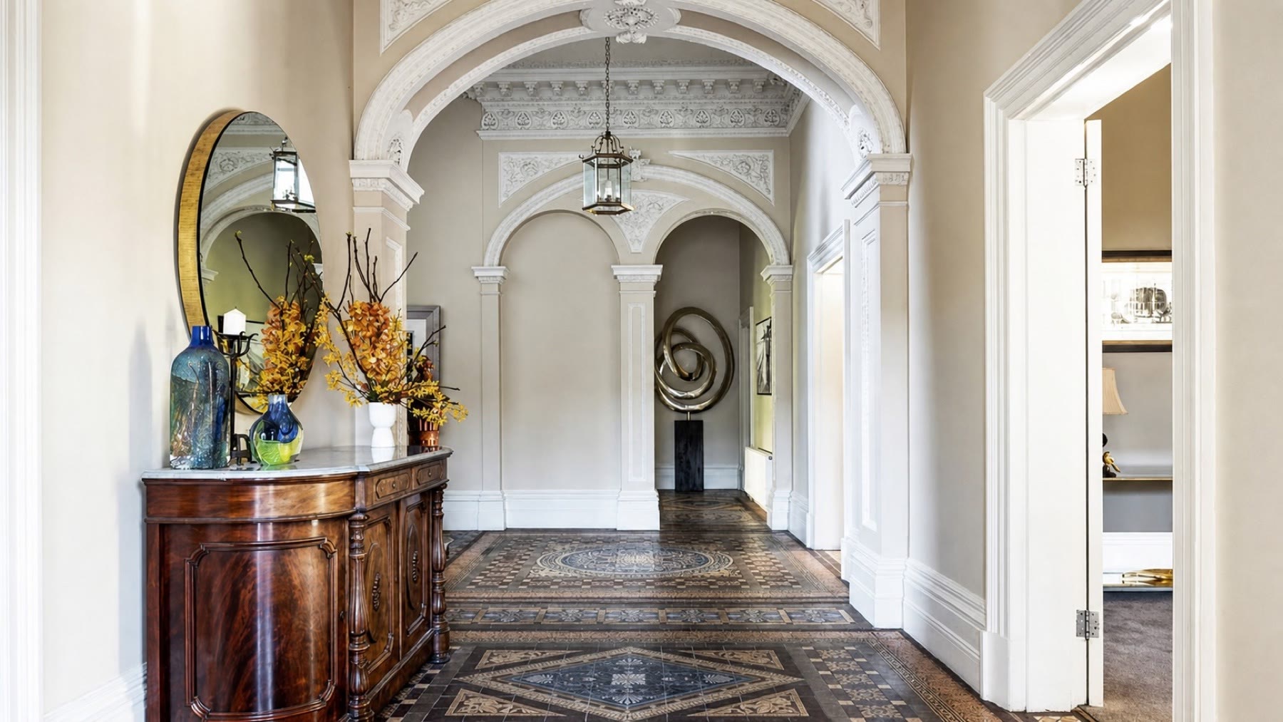 Heritage entry with decorative tile floors in an Elya Hawthorn project